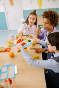 school students share lunch break